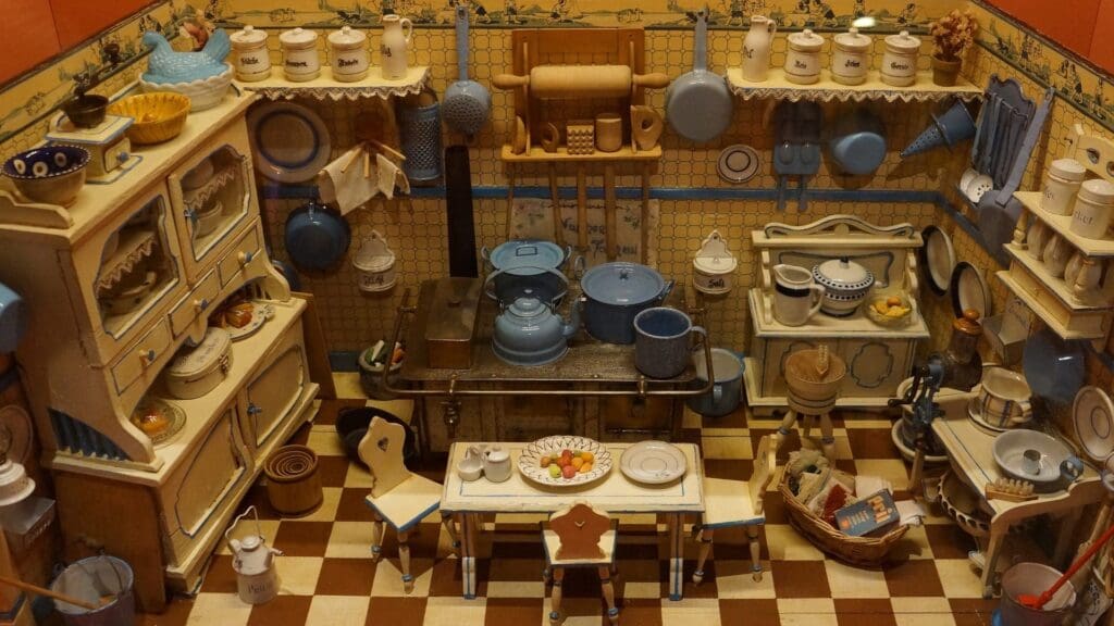 A miniature kitchen with a checkered floor.