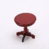 A small red wooden table on a white background.