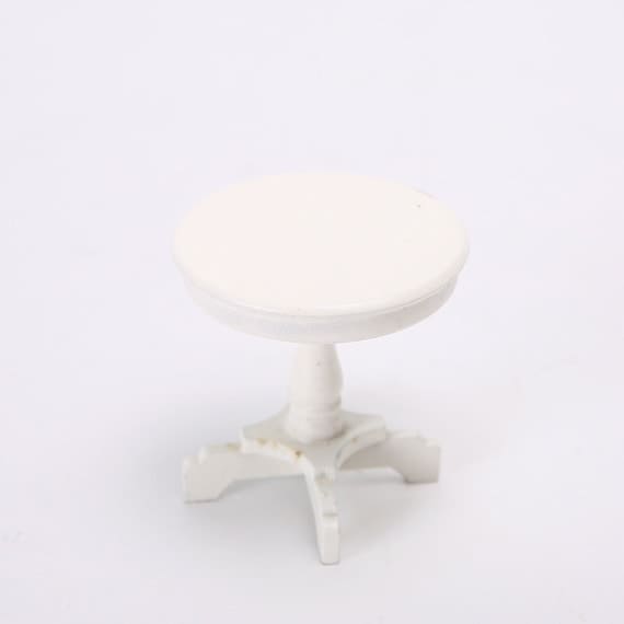 A small white table on a white background.